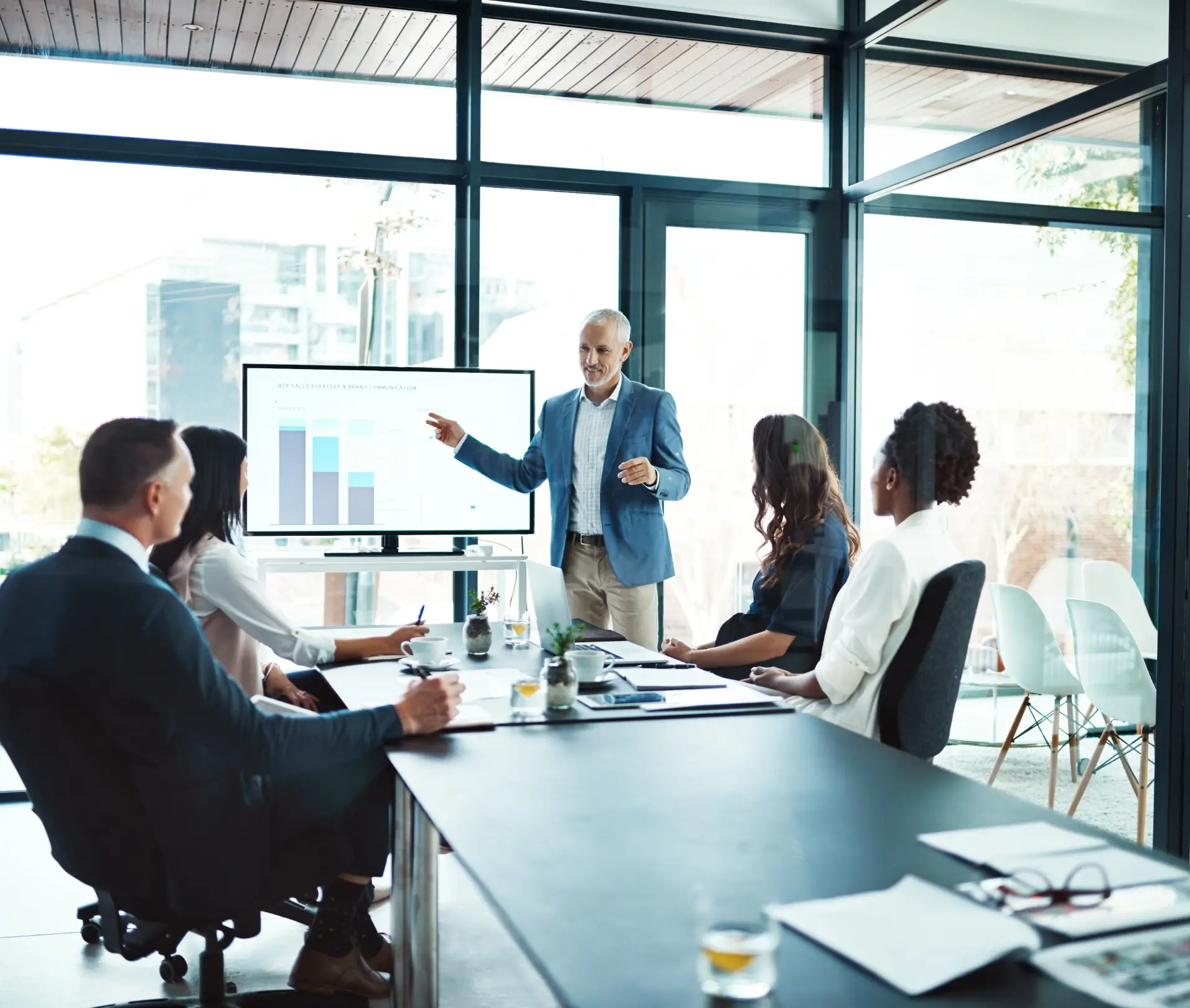 Businessman giving presentation to team.